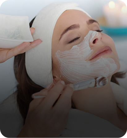 Therapist performing a lymphatic drainage massage in a spa setting.